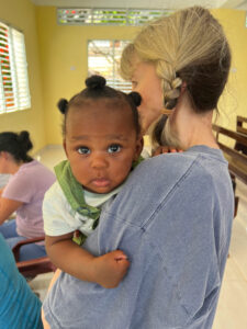 Words of appreciation - holding baby at medical clinic