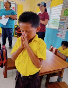 Belize praying boy